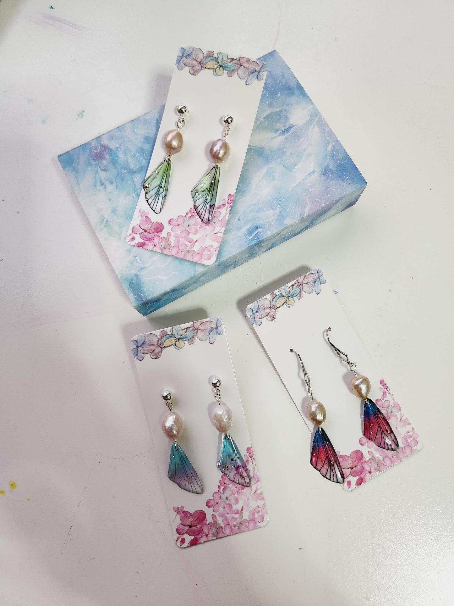Pearl earrings with fairy wings